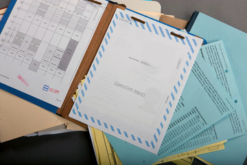 A stack of open file folders