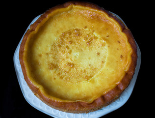 homemade cheesecake isolated on black