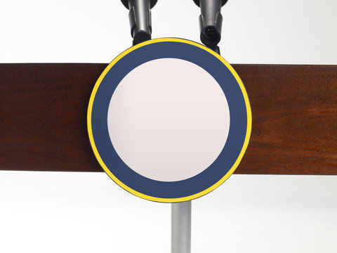 Extreme close up of a podium with two microphones