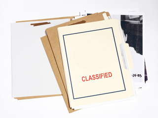 Several confidential file folders with pictures