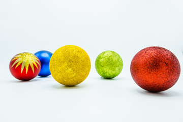 Red, green, gold and blue christmas balls.