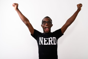 Studio shot of happy young black African geek man with both arms