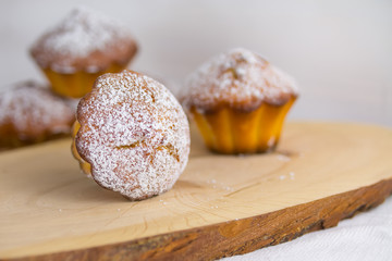traditional muffins or baked basic cupcakes close up, selective focus