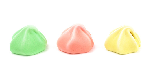 Line of Three Different Colored Meringues on a White Background