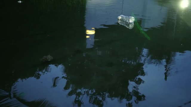 Car running and plastic bottle garbage floating on the flooded city - Trash and natural disaster problem