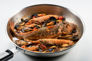 Pan with Tub gurnard prawn mussels olives and tomatoes