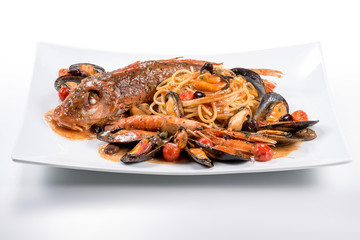 Plate of spaghetti with Tub gurnard prawn mussels olives and tomatoes