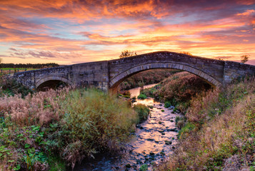 River Blyth under Bellasis Bridge, the humped-back stone bridge is grade 2 listed, seen here at...