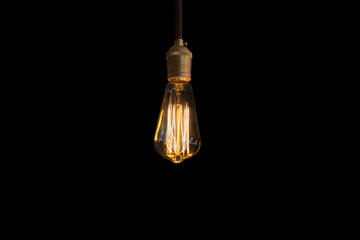 vintage light bulb on black background.