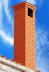 brick smokestack isolated on background of sky