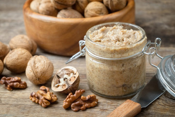 Raw organic walnut butter and fresh nuts.