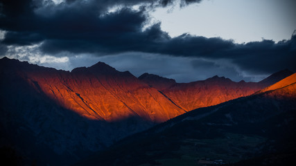 Maritime Alps in South of France illuminated by dramatic sunset light and skies © Ian