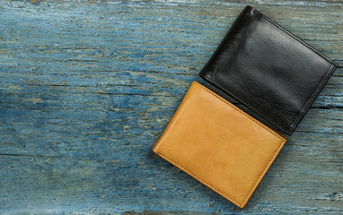 Leather wallet on wood texture