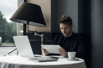 Young man drawing template for the web site associated with digital marketing, current trends and...