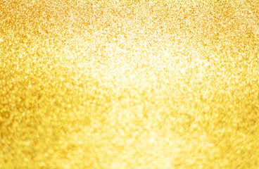 Gold background of glitter.  Christmas, defocused light