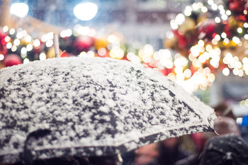 Umbrella in the snow at the Christmas market