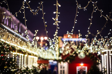 Christmas illumination, market shop, festively decorated. background blur