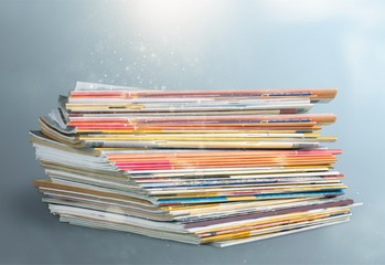 Pile of newspapers on white background