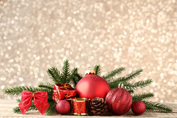 Christmas decorations with fir tree branches on bokeh background
