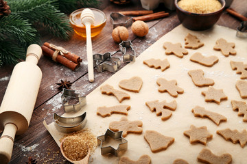Baking christmas cookies on brown wooden table