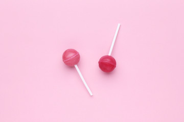 Sweet lollipops on pink background