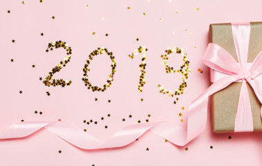 2019 new year text made from stars on pink background.