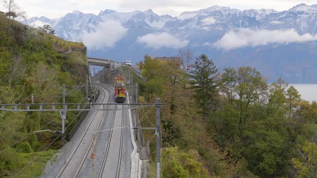 Work train with railwaymen repairing damaged catenary line. Lake L&radic;&copy;man and the Alps in the background
Swiss railway network. "Pont de Bory" Lavaux - Switzerland