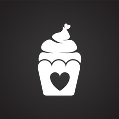 Cupcake with heart on black background icon