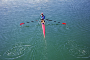 Single scull rowing competitor, rowing race one rower