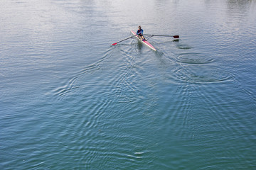 Single scull rowing competitor, rowing race one rower