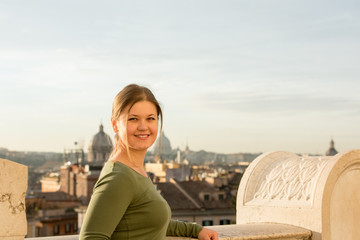 Fototapeta na wymiar Woman on roof in Rome