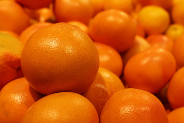 Ripe mandarins on a market. Fresh harvest of tangerines