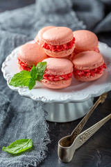 Almond cakes macarons with cream flowers.
