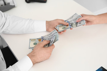 Man with toilet paper in pocket suffering from diarrhea on color background