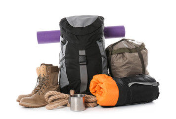 Set of camping equipment with sleeping bag on white background