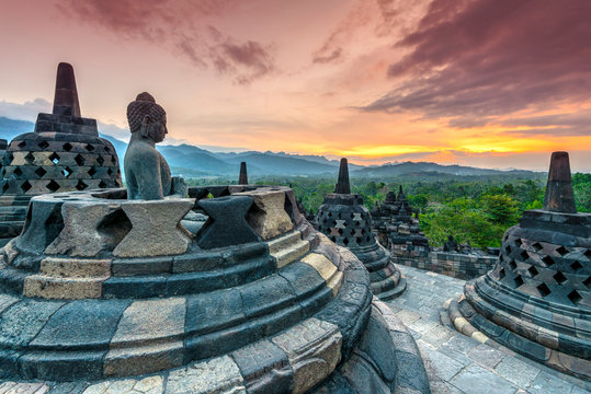Buddha statue at Borobudur Temple during sunset