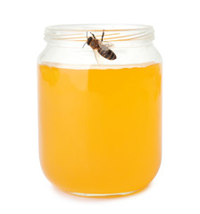 Jar with honey and bee on white background