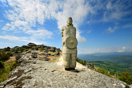 A galician-lusitanian warrior watch the horizon on the top of the Iron Age settlement of Outeiro Lesenho at 1073m. Boticas, Tras os Montes. Portugal