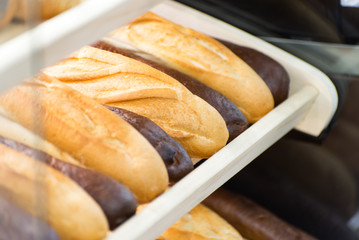 different types of bread on the shelf in the store closeup
