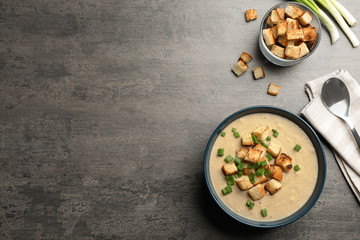 Bowl of fresh homemade mushroom soup on white background, top view