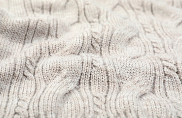 Fototapeta na wymiar Texture of cozy warm sweater as background, closeup
