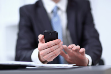 close up.businessman typing text message on smartphone