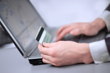 Businessman doing online banking, making a payment or buying a product on the Internet