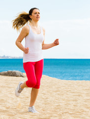 Woman running on beach