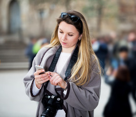 Girl searching for the direction using her phone