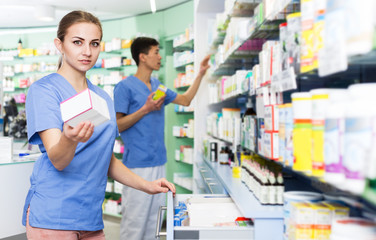 Pharmacist looking medicines in lockers