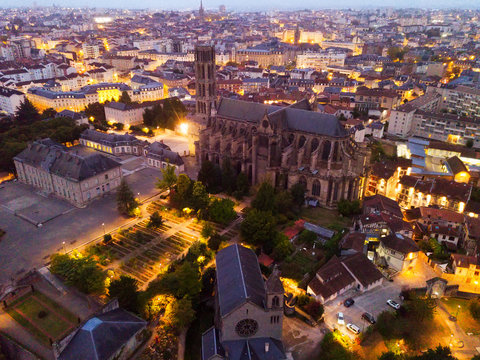 Historical aerial view of Limoges Cathedral illuminated at dusk, France