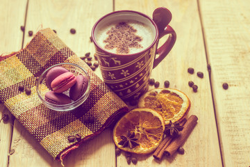cup of coffee with a new year pattern. Christmas tree made of cinnamon in a cup with coffee. good New Year spirit. New Year's and Christmas.