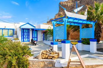 Entrance to typical Greek taverna on street of Finiki village, Karpathos island, Greece