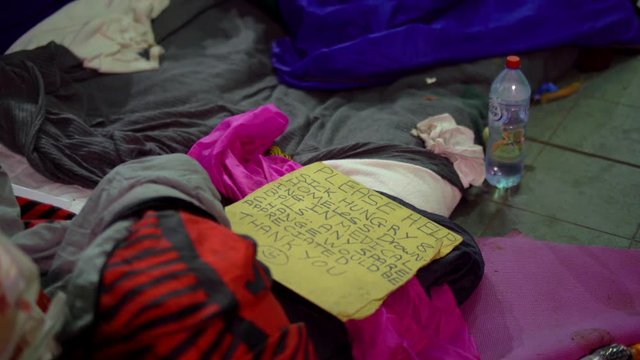 Tilt up to Homeless Person's Belongings